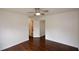 Bedroom featuring hardwood floors, easy access to the bathroom, and a ceiling fan at 2001 Mclain Nw Rd, Acworth, GA 30101