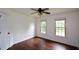 Cozy bedroom with hardwood floors, and two windows overlooking the outside at 2001 Mclain Nw Rd, Acworth, GA 30101