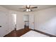 Bright bedroom featuring hardwood floors, a ceiling fan, and a walk-in closet at 2001 Mclain Nw Rd, Acworth, GA 30101