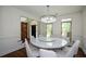 Bright dining room featuring a modern chandelier and large windows offering natural light at 2001 Mclain Nw Rd, Acworth, GA 30101