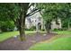 Stately brick home with mature trees, a verdant lawn, and meticulous landscaping at 2001 Mclain Nw Rd, Acworth, GA 30101