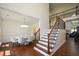Spacious foyer showcasing hardwood floors, stairs, and a dining area at 2001 Mclain Nw Rd, Acworth, GA 30101