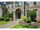 Close up of the home's entrance and well-maintained landscaping at 2001 Mclain Nw Rd, Acworth, GA 30101
