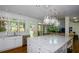 Bright kitchen with a marble island, stainless steel appliances, and views of the backyard at 2001 Mclain Nw Rd, Acworth, GA 30101