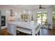Spacious kitchen with a marble island, modern pendant lights, and stainless steel appliances at 2001 Mclain Nw Rd, Acworth, GA 30101
