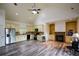 Open concept kitchen with stainless steel appliances, ample cabinet space, and modern lighting at 2001 Mclain Nw Rd, Acworth, GA 30101