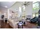Bright living room featuring high ceilings, large windows, fireplace, and hardwood floors at 2001 Mclain Nw Rd, Acworth, GA 30101