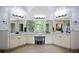 Bright, open bathroom with double sinks, large vanity, and a view of a walk-in shower at 2001 Mclain Nw Rd, Acworth, GA 30101