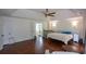Large main bedroom with hardwood floors, crib, and sitting area with access to the main bathroom at 2001 Mclain Nw Rd, Acworth, GA 30101