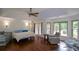 Spacious main bedroom features tray ceiling, hardwood floors, sitting area, and access to a private deck at 2001 Mclain Nw Rd, Acworth, GA 30101
