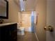 Traditional bathroom with a tub and shower, modern vanity, and tile floors at 3889 Sidney Lanier Blvd, Duluth, GA 30096