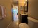 Traditional bathroom with a small vanity, mirror, and decorative lights at 3889 Sidney Lanier Blvd, Duluth, GA 30096
