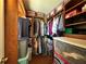 Walk-in closet features ample storage with built in shelving and room for organization at 3889 Sidney Lanier Blvd, Duluth, GA 30096