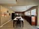 Dining room with an elongated table, stainless steel appliances, and bright windows at 3889 Sidney Lanier Blvd, Duluth, GA 30096
