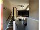 Bright foyer with hardwood floors, staircase, and a view into the living room at 3889 Sidney Lanier Blvd, Duluth, GA 30096