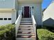 Inviting front entrance with stairs leading to a red front door and well-manicured shrubs at 3889 Sidney Lanier Blvd, Duluth, GA 30096