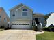 Charming two-story home with a two-car garage and well-maintained front yard at 3889 Sidney Lanier Blvd, Duluth, GA 30096