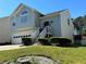 Traditional home with a two-car garage, well-kept lawn, and inviting front entrance at 3889 Sidney Lanier Blvd, Duluth, GA 30096