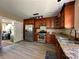 Updated kitchen features granite counters, stainless appliances, and wood cabinets with modern fixtures at 3889 Sidney Lanier Blvd, Duluth, GA 30096