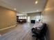 Spacious living room featuring wood floors, fireplace, and open access to the dining area at 3889 Sidney Lanier Blvd, Duluth, GA 30096