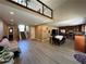 Open-concept living space with hardwood floors, dining area, and modern kitchen at 3889 Sidney Lanier Blvd, Duluth, GA 30096