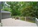 Backyard wooden deck features white railings and wooded views at 4766 Jamerson Forest Cir, Marietta, GA 30066