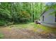 A secluded backyard with stepping stones is perfect for outdoor activities and relaxation at 4766 Jamerson Forest Cir, Marietta, GA 30066