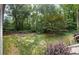 A beautifully landscaped backyard offers a serene retreat with privacy and greenery at 4766 Jamerson Forest Cir, Marietta, GA 30066