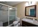 Bathroom with tiled shower, granite vanity, and dark wood cabinets at 4766 Jamerson Forest Cir, Marietta, GA 30066