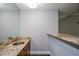 Bathroom features a granite countertop and a large mirror at 4766 Jamerson Forest Cir, Marietta, GA 30066