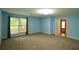 Light blue bedroom featuring carpet, a window, and ensuite access at 4766 Jamerson Forest Cir, Marietta, GA 30066