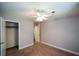 Bedroom featuring carpet, a ceiling fan, and ensuite closet at 4766 Jamerson Forest Cir, Marietta, GA 30066