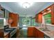 Kitchen with stainless steel appliances and access to the outdoor deck at 4766 Jamerson Forest Cir, Marietta, GA 30066