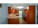 Kitchen boasts warm cabinetry, granite countertops, and stainless appliances at 4766 Jamerson Forest Cir, Marietta, GA 30066