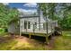 Lovely home exterior featuring a charming wooden deck and access to the backyard at 4766 Jamerson Forest Cir, Marietta, GA 30066