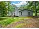 The exterior reveals a lovely deck and ample outdoor space for relaxation and enjoyment at 4766 Jamerson Forest Cir, Marietta, GA 30066