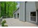 Exterior view of deck area leading to backyard with lush greenery and trees at 4766 Jamerson Forest Cir, Marietta, GA 30066