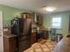 Kitchen featuring dark cabinets, granite countertops, and stainless steel appliances at 1130 Monfort Rd, Lawrenceville, GA 30046