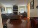 Spacious living room with a fireplace, large windows, and hardwood floors at 1130 Monfort Rd, Lawrenceville, GA 30046