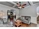 Cozy living room features hardwood floors, a ceiling fan, and gray walls with white trim at 2020 Walking Horse Trl, Cumming, GA 30041