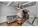 Comfortable living room with coffered ceiling, hardwood floors, and two sofas facing each other at 2020 Walking Horse Trl, Cumming, GA 30041