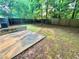 Large, fenced backyard with a concrete patio perfect for entertaining and summer barbecues at 4610 Idlewood Park, Lithonia, GA 30038