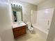 Bathroom featuring vanity with sink, toilet and tub/shower combination for a functional and comfortable experience at 4610 Idlewood Park, Lithonia, GA 30038