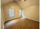 Spacious bedroom with vaulted ceiling, neutral carpet and a large window, offering a comfortable retreat at 4610 Idlewood Park, Lithonia, GA 30038