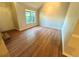 Bright and airy living room featuring wood-look floors and a large window, creating a welcoming space at 4610 Idlewood Park, Lithonia, GA 30038