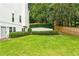 Spacious backyard featuring lush green grass and a well-maintained fence for privacy at 505 Woodmoore Ct, Sandy Springs, GA 30342