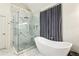 Elegant bathroom with a freestanding tub, glass shower, and marble accents throughout at 505 Woodmoore Ct, Sandy Springs, GA 30342