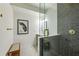 Modern bathroom with gray subway tile shower, glass door, and stylish patterned flooring at 505 Woodmoore Ct, Sandy Springs, GA 30342