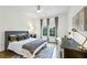 Bedroom featuring a desk, large window, and neutral colors at 505 Woodmoore Ct, Sandy Springs, GA 30342
