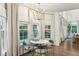 Bright breakfast nook with large windows and custom draperies at 505 Woodmoore Ct, Sandy Springs, GA 30342